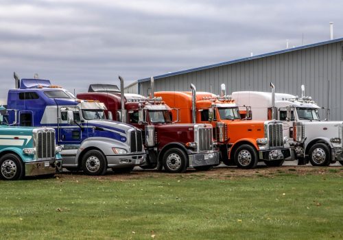 New semi-trucks lined up outside of Stoller Trucking