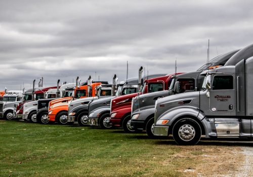Colorful trucks parked outside of Stoller Trucking