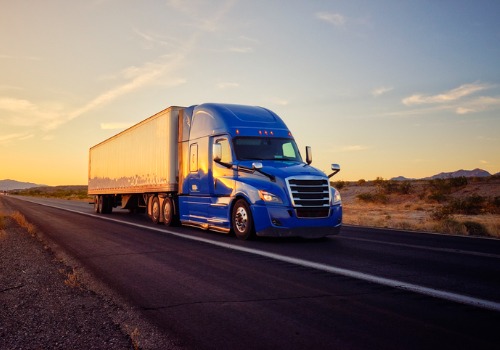 Blue truck at sunset driving for truck driver jobs in Iowa