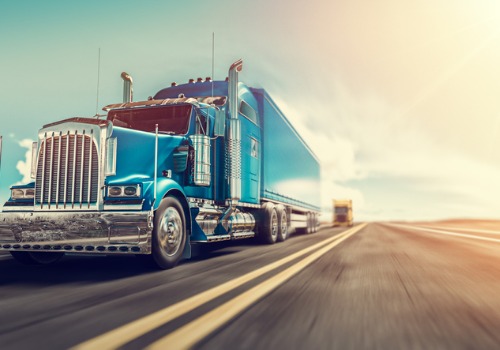 A blue truck going fast while working truck driving jobs in Iowa