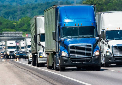 Blue semi-truck on highway, part of Trucking Jobs in Michigan