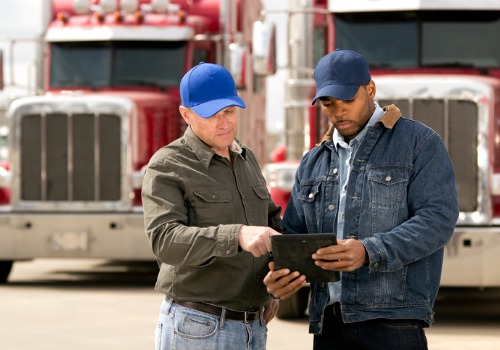 Two truck drivers discussing their Truck Driver Jobs in Grand Rapids MI