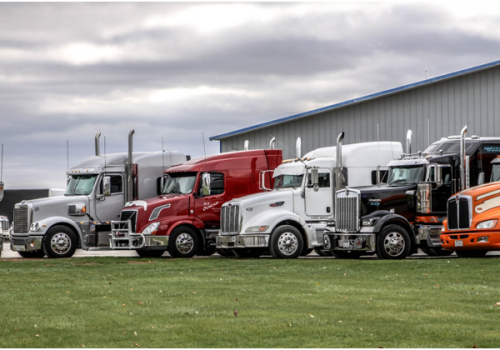 A line of trucks at Stoller Trucking