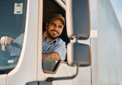 A happy man who enjoys working Trucking Jobs in Detroit MI