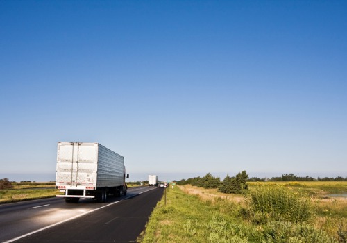 Trucks on a Midwestern heighway for Trucking Jobs in Des Moines IA