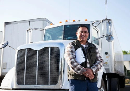 A happy driver checking truck before starting Freight Shipping in Milwaukee WI