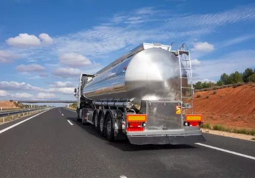 A Non-Hazardous Liquid Tanker in transit, representing Stoller Trucking's specialized transport services.